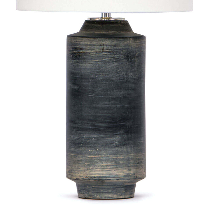 Textured, multicoloured dark ceramic base on the modern table lamp with an industrial feel.