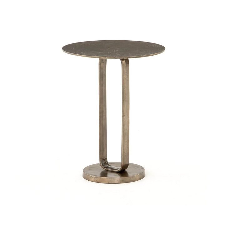 The Duke End Table is an modern side table with a round tabletop and ring, pedestal base in a textured aged bronze finish.