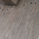 Closeup of the reclaimed pine wood grain on the crossbeam base of the Honey Brook Dining Table.