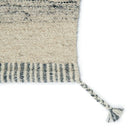 The Flora Rug Collection features textural, braided tassels in a mix of grey and ivory. 