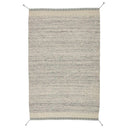 The Flora Rug Collection in Ivory/Grey. Made of 100% wool, this rug has been handwoven and features braided tassels on the corners.