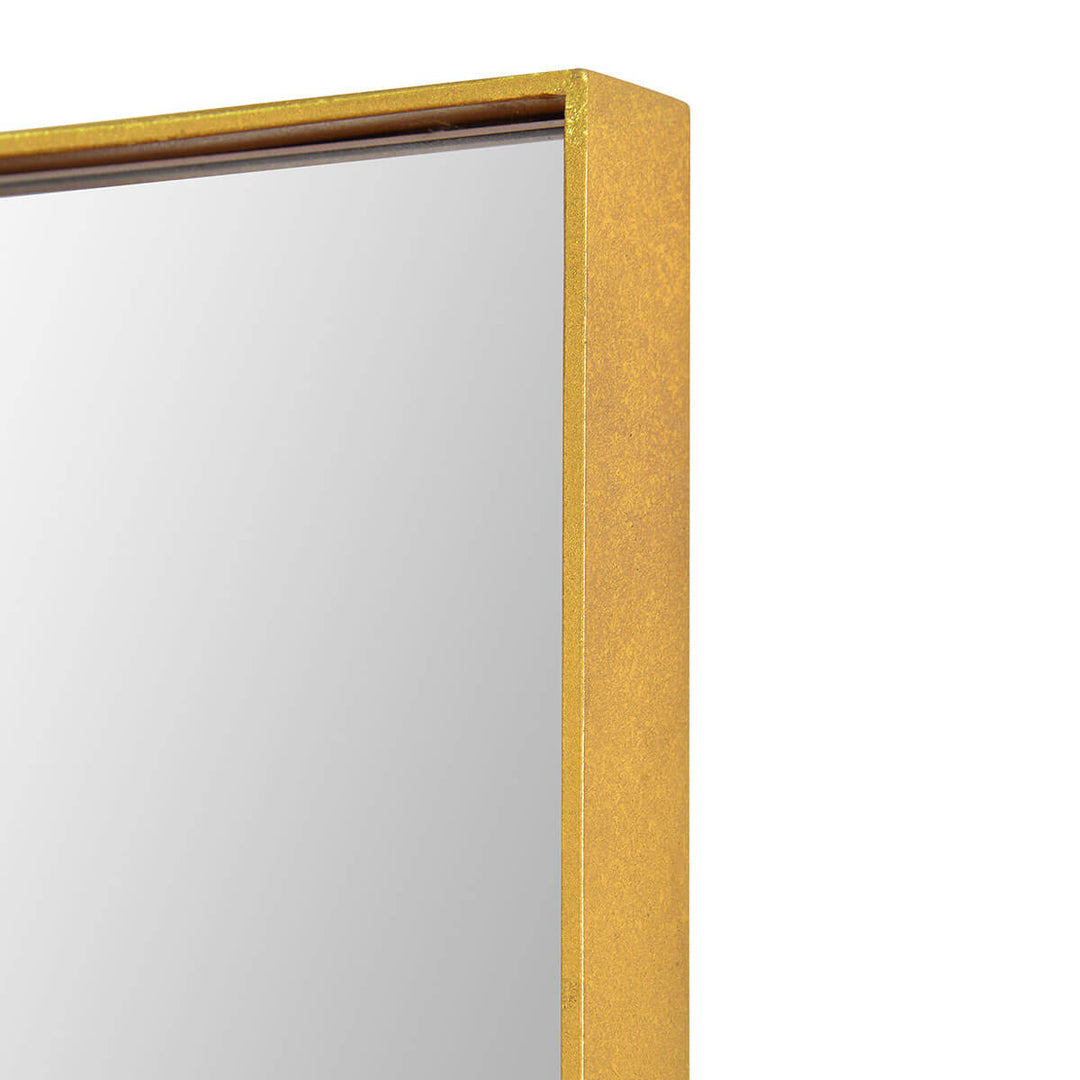 Thin gold frame on an oversized rectangular mirror.