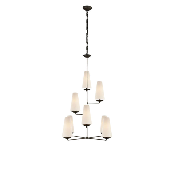The Fontaine Vertical Chandelier is a high-ceiling chandelier with eight staggered, vertical lights with linen lamp shades and an aged iron stem.