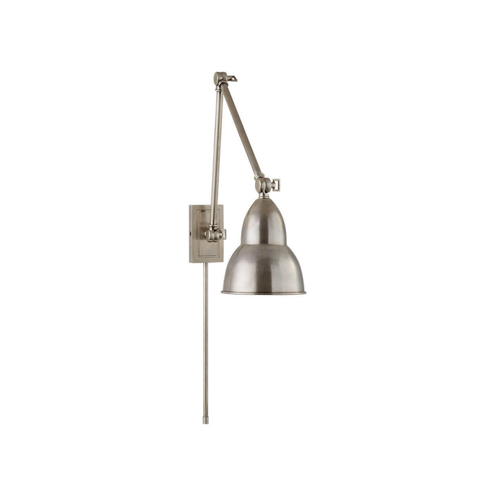 The French Library Wall Lamp hinges in three spots and has a classic shape in an antique nickel finish.