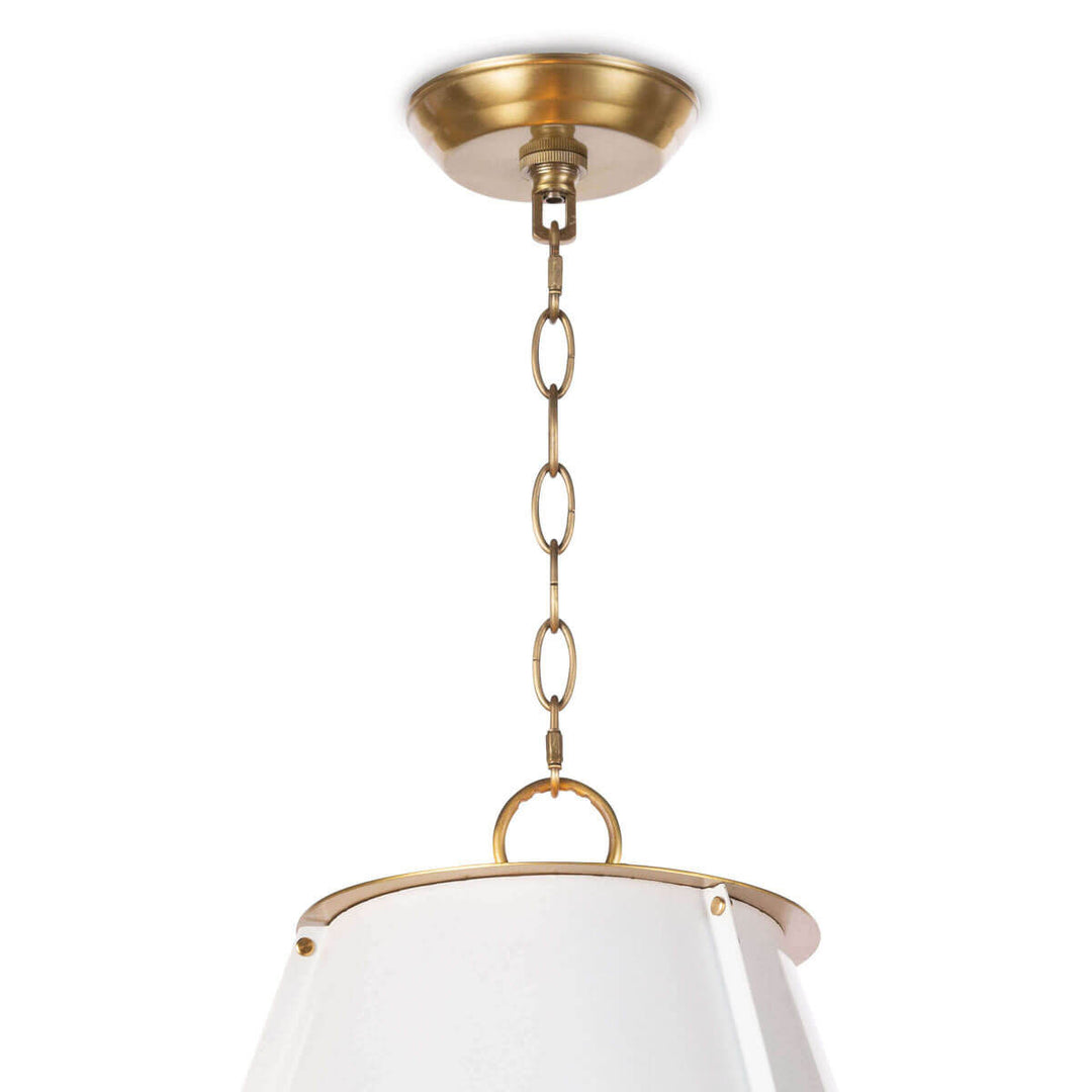 Closeup of the brass canopy and chain on the modern pendant light.