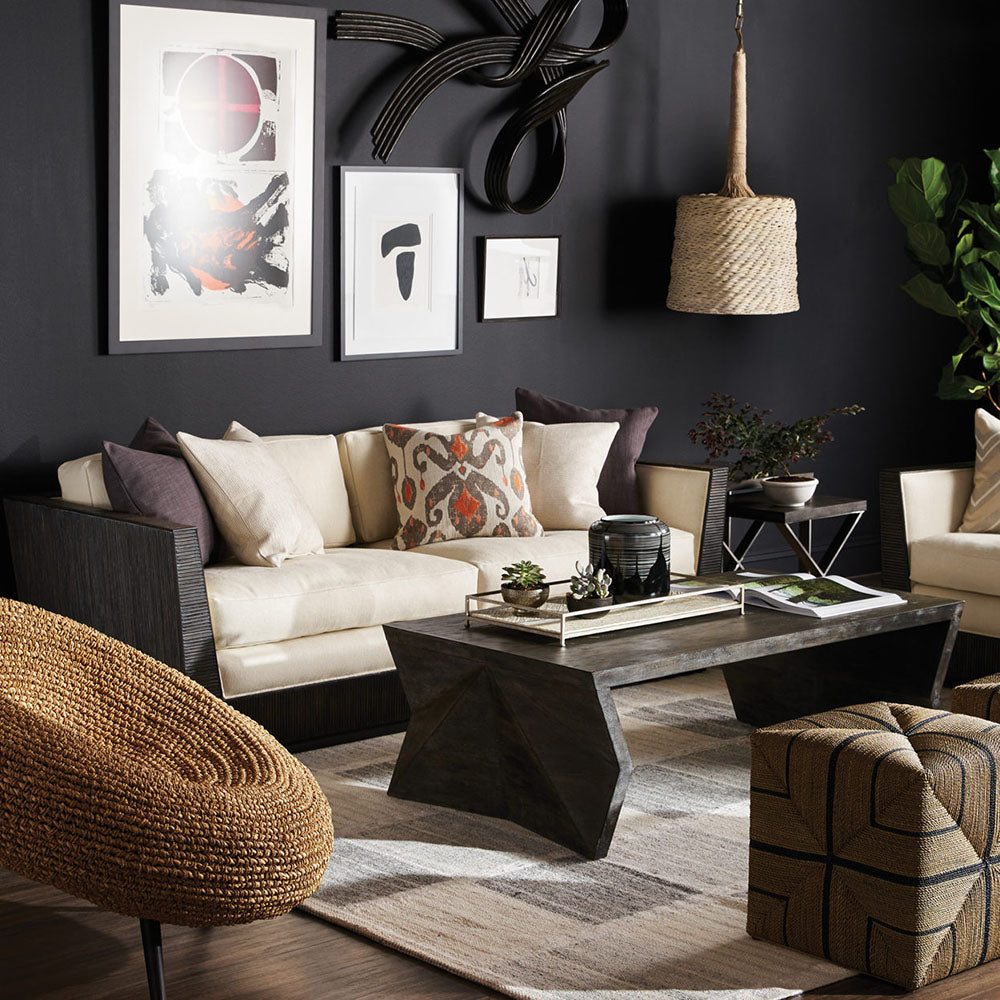 Modern cube shaped ottoman with lots of texture in a living room.