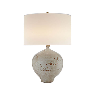 The Gaios Table Lamp has a rounded, textured pharaoh white body and a round linen shade.