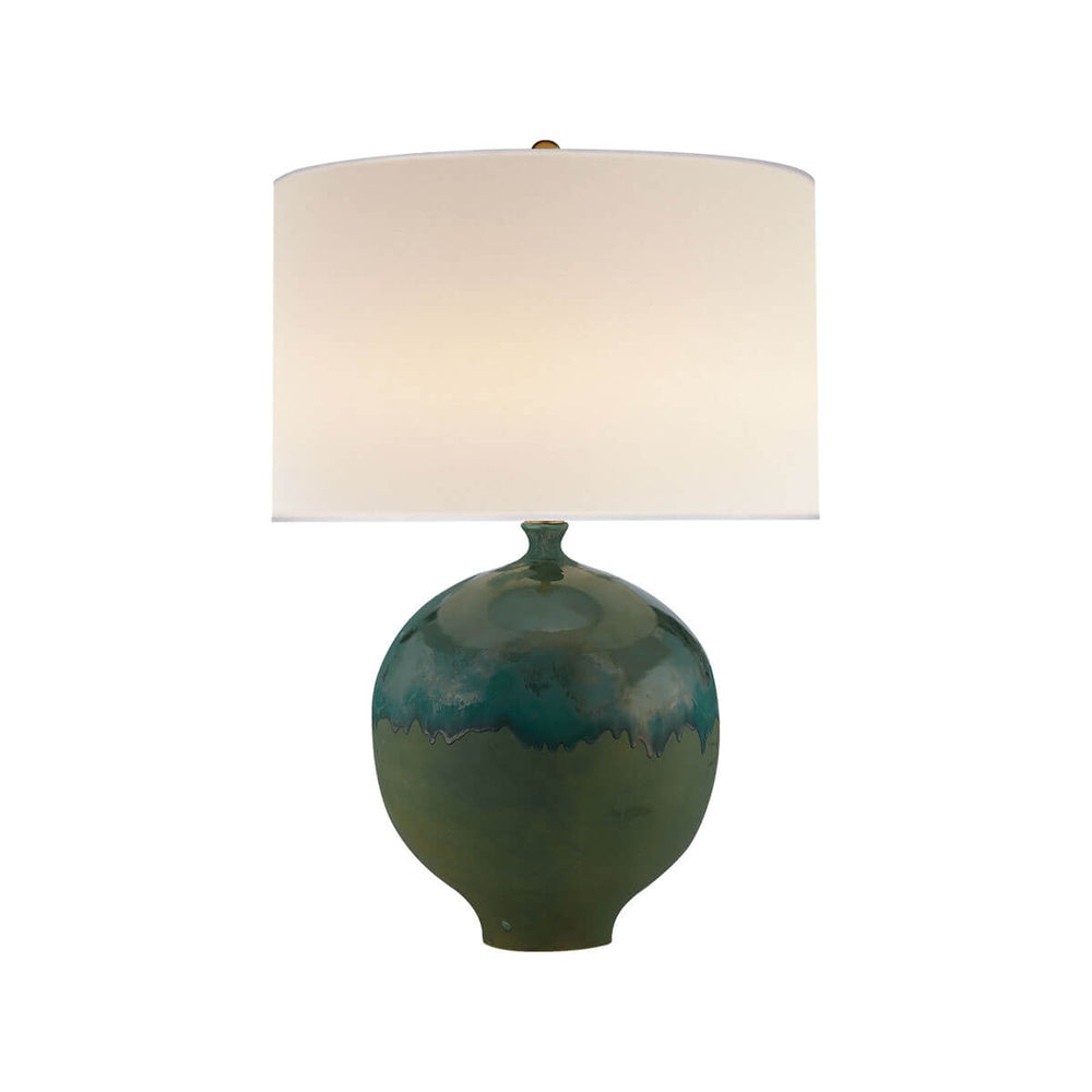 The Gaios Table Lamp has a rounded, textured volcanic verdi body and a round linen shade.