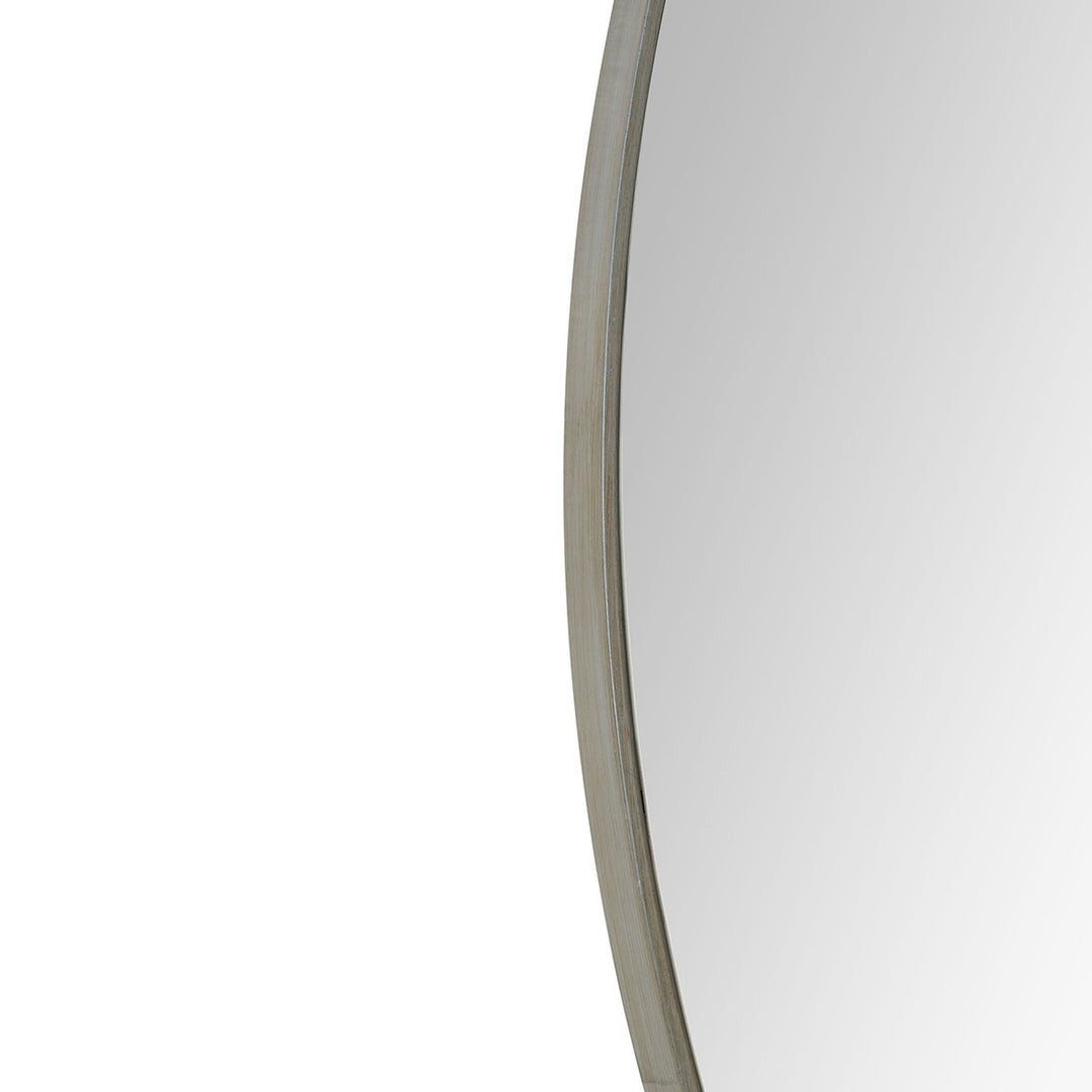 Slim, raw iron frame on a modern circular mirror.