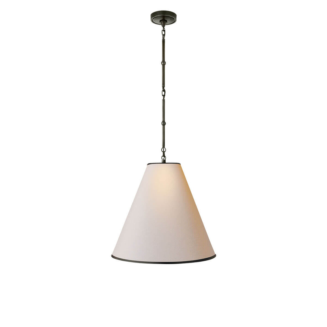 The Hartford Medium Hanging Light has a delicate bronze chain with antique brass detail and natural paper cone shaped shade