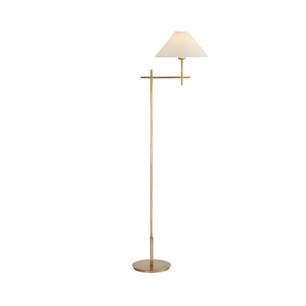 The Hackney Bridge Arm Floor Lamp has a thin, classy body in a hand-rubbed antique brass finish with an extended, adjustable bridge arm and round natural paper shade.