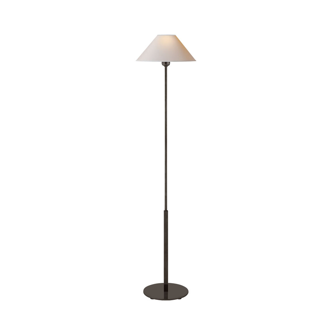 The Hackney Floor Lamp has a thin body in a bronze finish and a round, natural paper lamp shade.