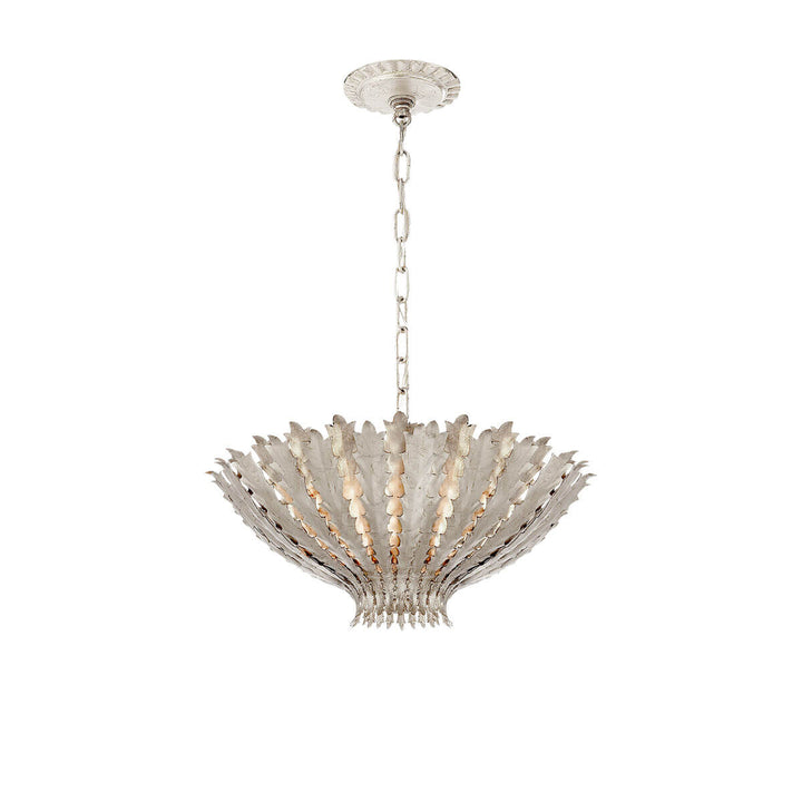 Modern, bowl shaped pendant with burnished silver leaf plated leaves on the shade.