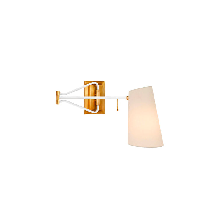 Swing Arm wall light. Hand aged brass with white. Linen shade.