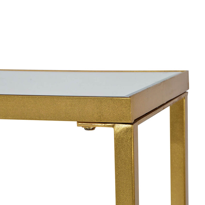 Gold leaf finish and mirror top on the simple living room console.