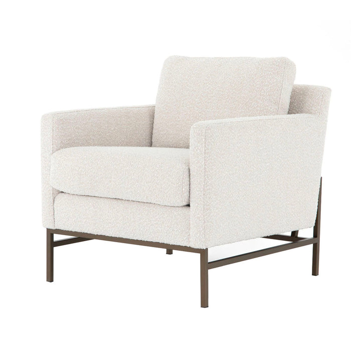 White plush arm chair with modern metal frame.