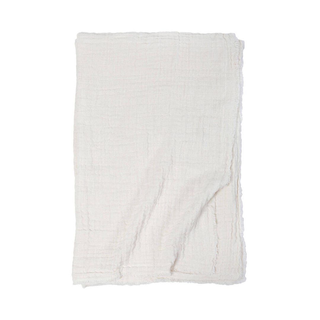 The Trento Oversized Throw is an double-sided gauzy weave throw blanket made from stonewashed cotton and linen