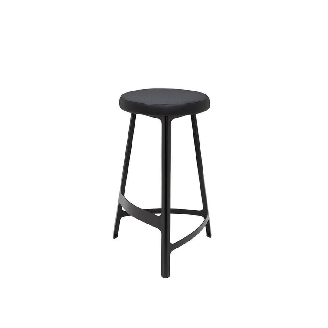 Black metal stool with slightly curved lines and a faux leather seat.