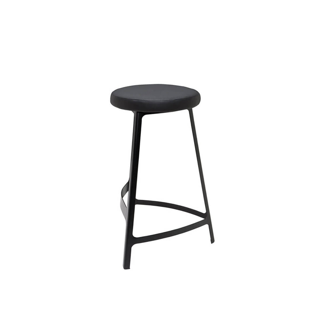 Modern bar stool with a matte black metal frame and naugahyde seat.