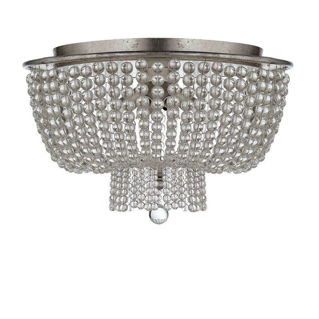 The Jacqueline Flush Mount has a silver leaf canopy and a pendant with strings of clear glass beads.