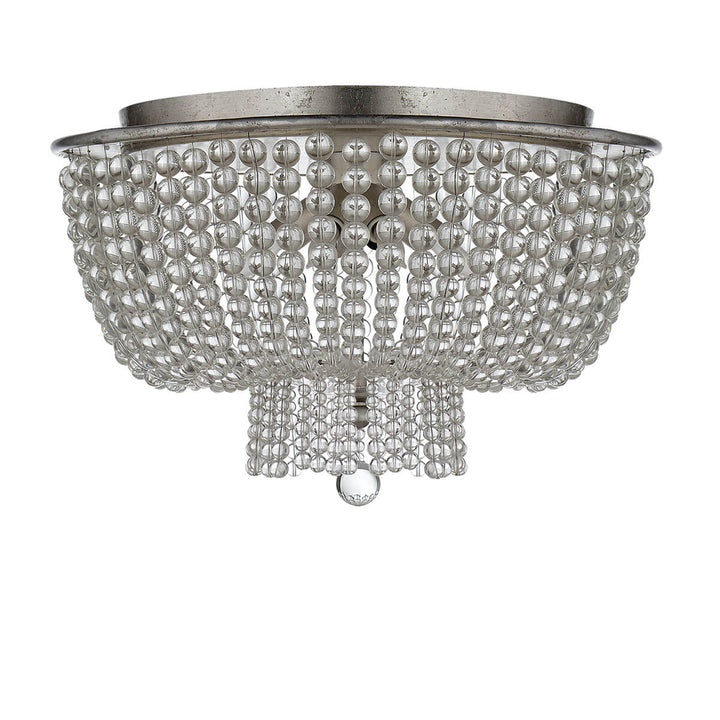 The Jacqueline Flush Mount has a silver leaf canopy and a pendant with strings of clear glass beads.