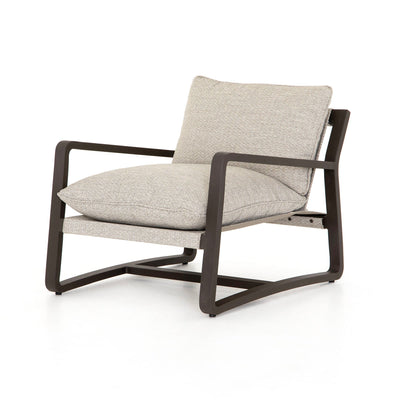 Grey outdoor lounge chair with bronze base.
