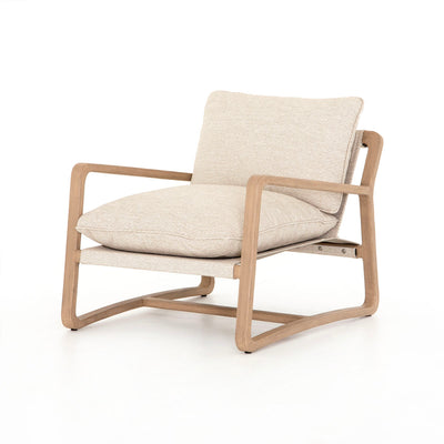 Outdoor beige lounge chair with teak frame.