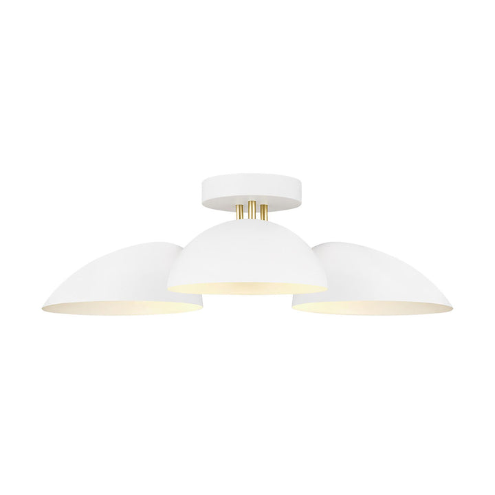 London Flush Mount with a burnished brass body and matte white glass shades.