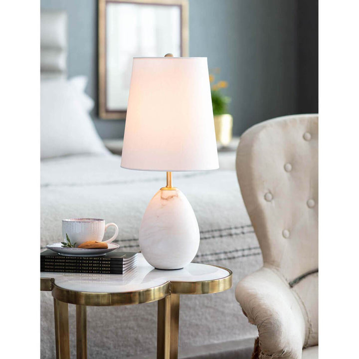 Mini table lamp with white shade in a traditional living room.