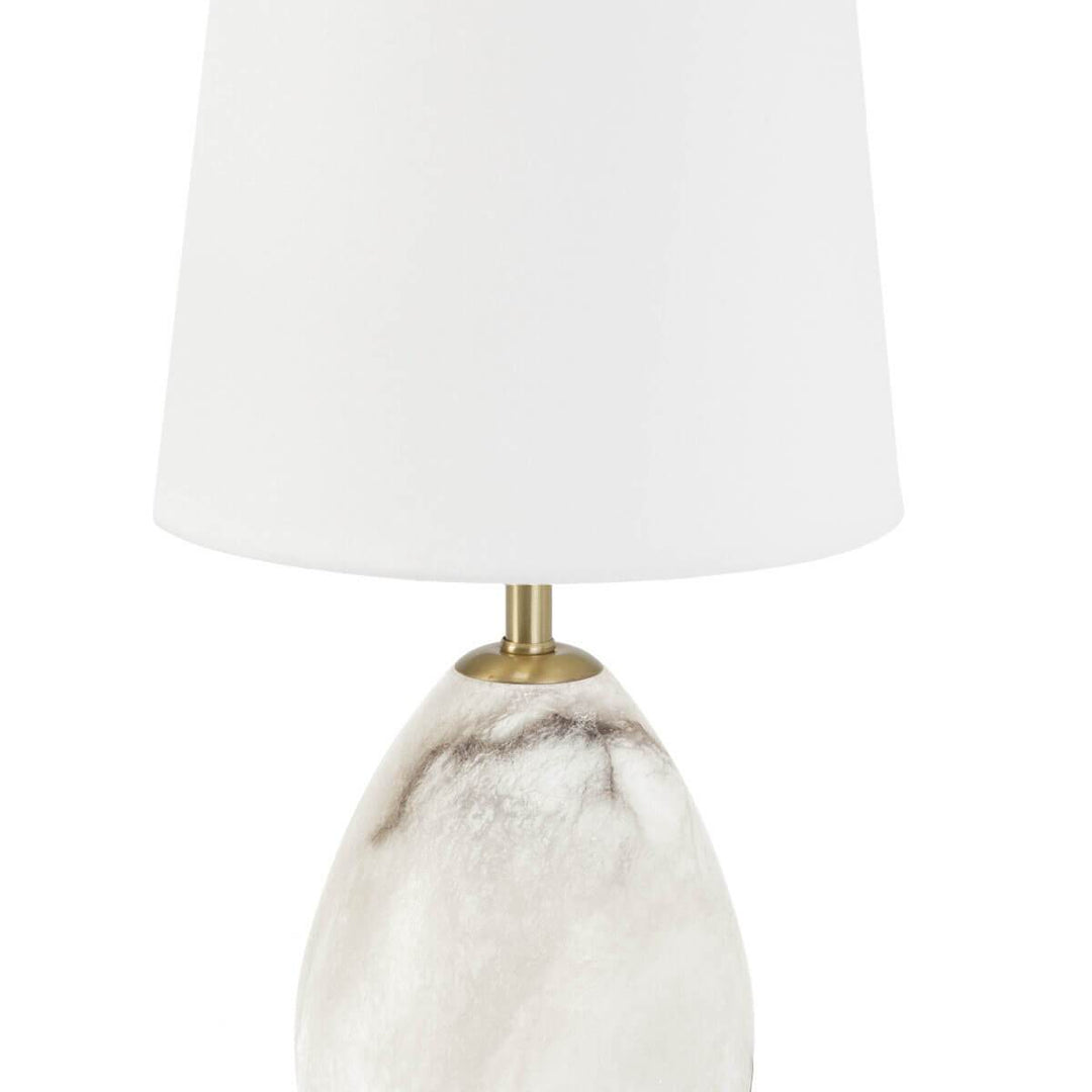 Traditional table lamp with a stone base and white lamp shade.