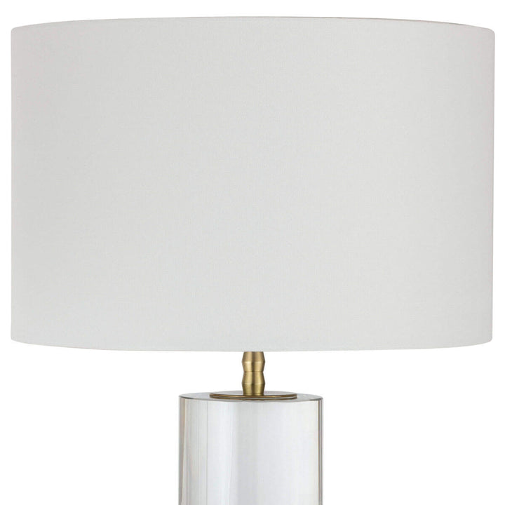 Neutral alabaster stone table lamp with a white linen shade and a modern look.