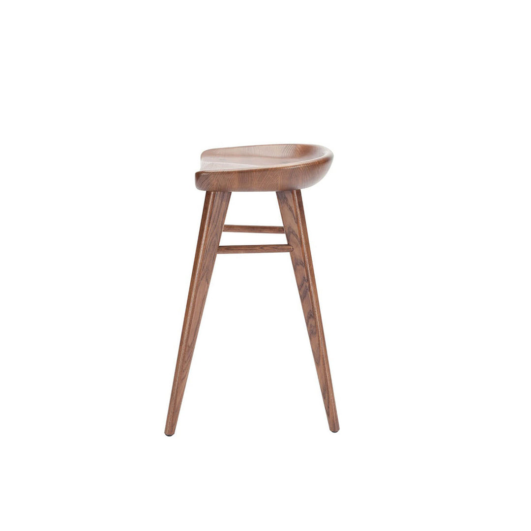 Side view of the curved seat and triangular legs on the simple backless counter stool.