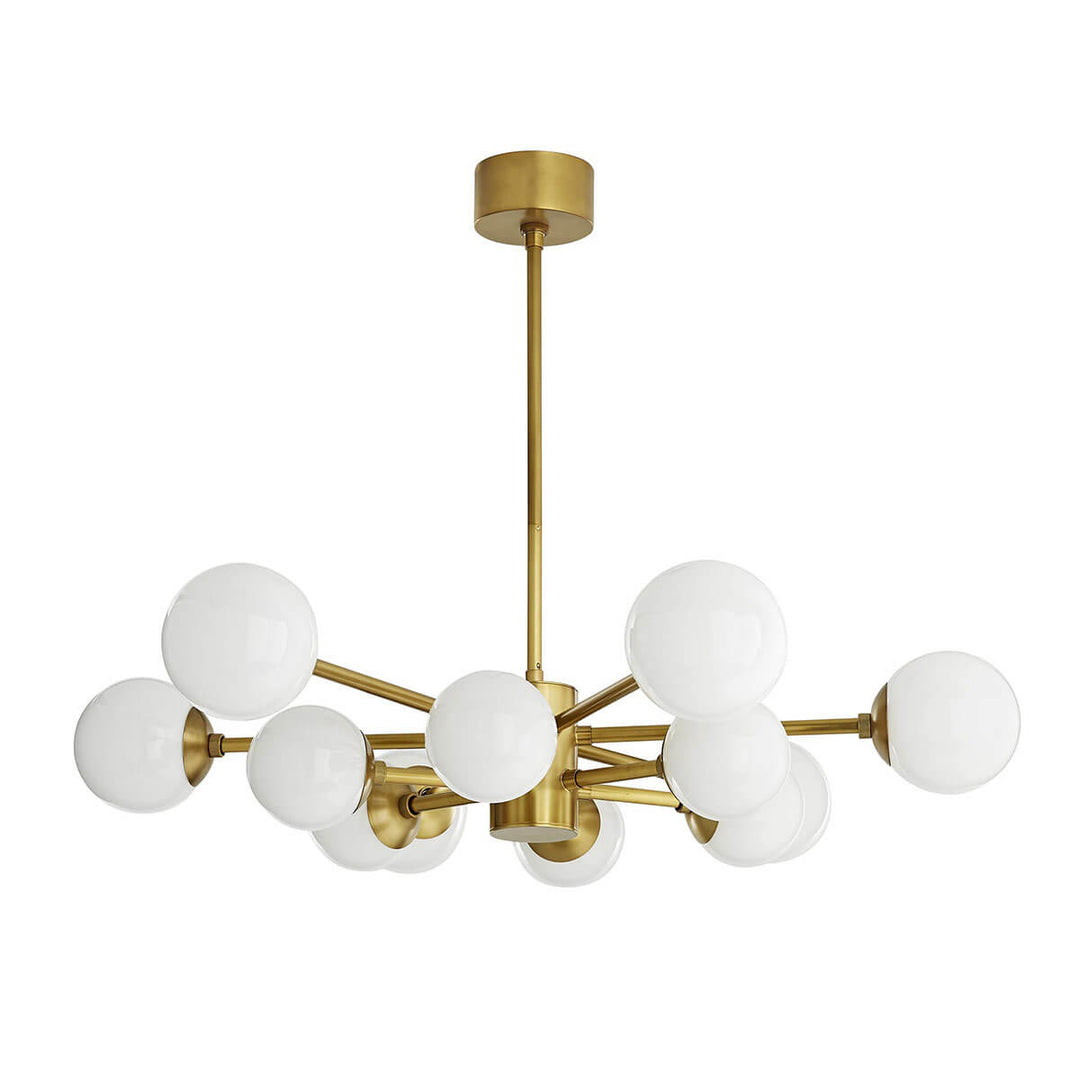 The Portland Chandelier with antique brass and opal glass spheres in an irregular symmetrical design.