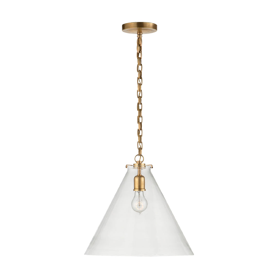The Katie Conical Pendant shows off the light bulb through its clear glass shade which contrasts against the Antique Brass chain and base.