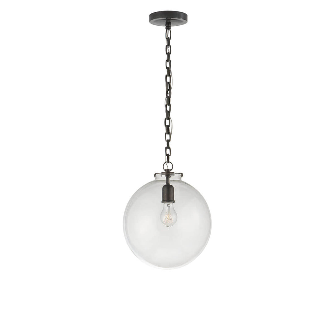 The Katie Globe Pendant is a clear glass globe ceiling light with a bronze chain and hardware.