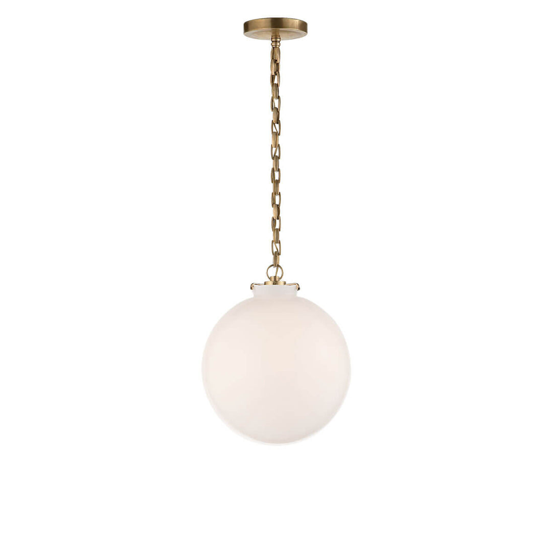 The Katie Globe Pendant is a white glass globe ceiling light with a hand-rubbed antique brass chain and hardware.