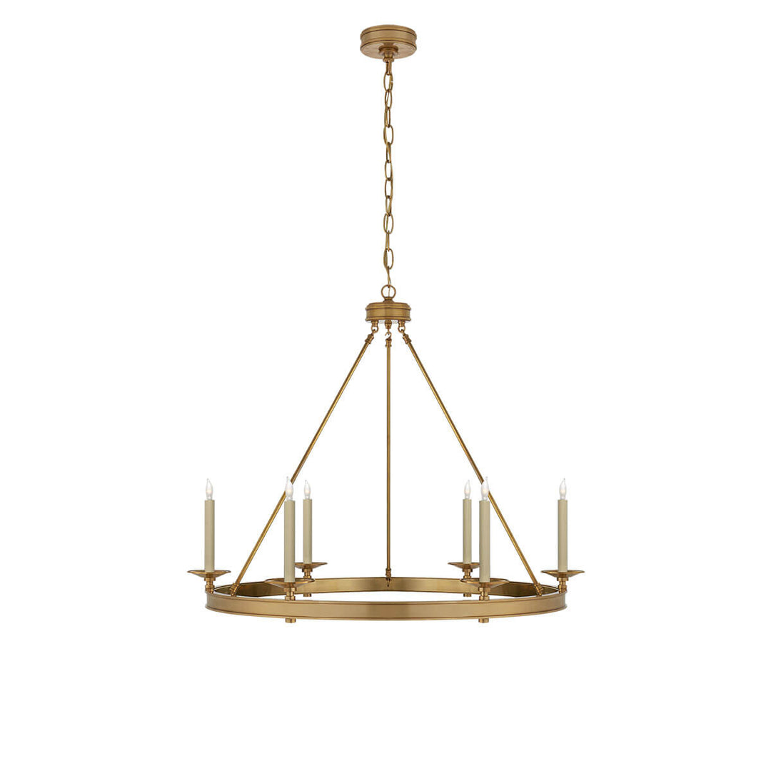 The Launceton Ring Chandelier is a large traditional, candelabra chandelier with an antique burnished brass finish and six candle lights around the circle base.
