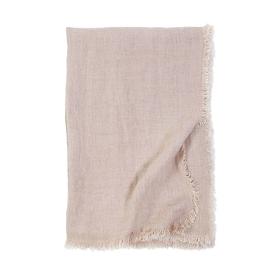 The Genoa Oversized Throw is an oversized light pink throw with 100% linen with frayed edges.