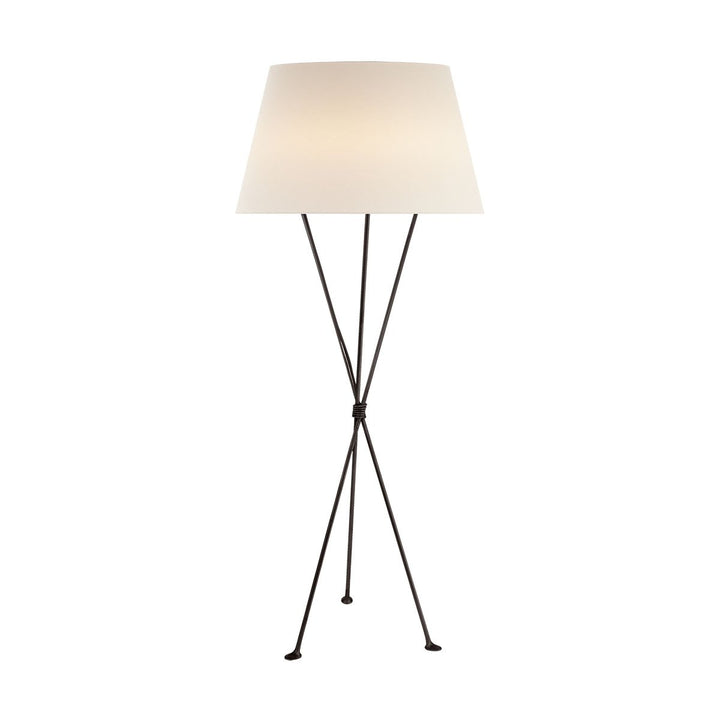 The Lebon Floor Lamp has three slim tripod legs in an aged iron finish with a white linen shade.