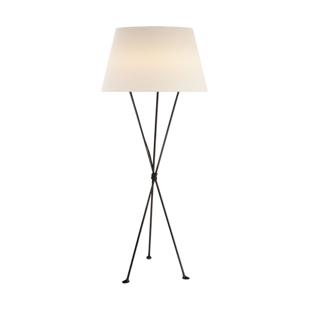 The Lebon Floor Lamp has three slim tripod legs in an aged iron finish with a white linen shade.