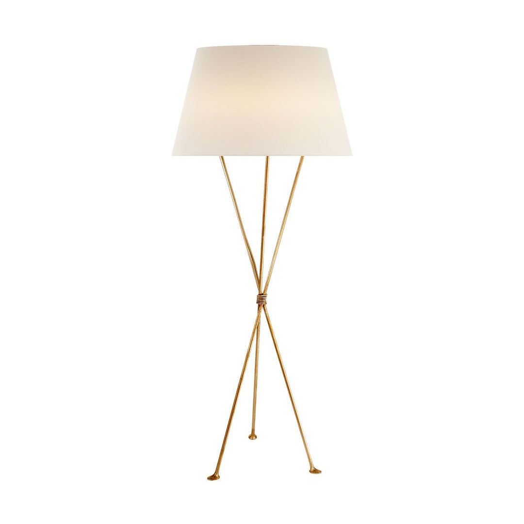The Lebon Floor Lamp has three slim tripod legs in a gild finish with a white linen shade.