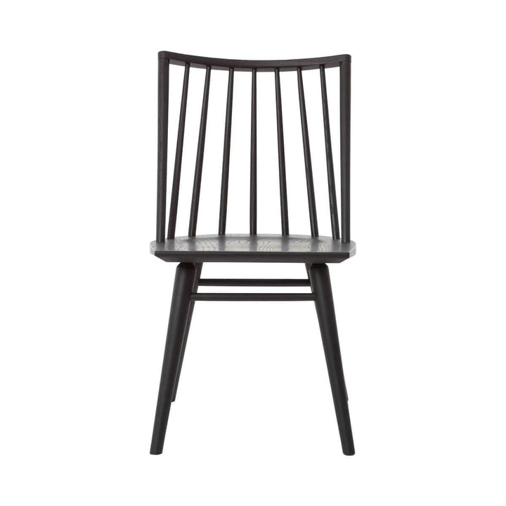 The Prineville Dining Chair is a solid wood chair with a rounded spindle back in a black oak finish.