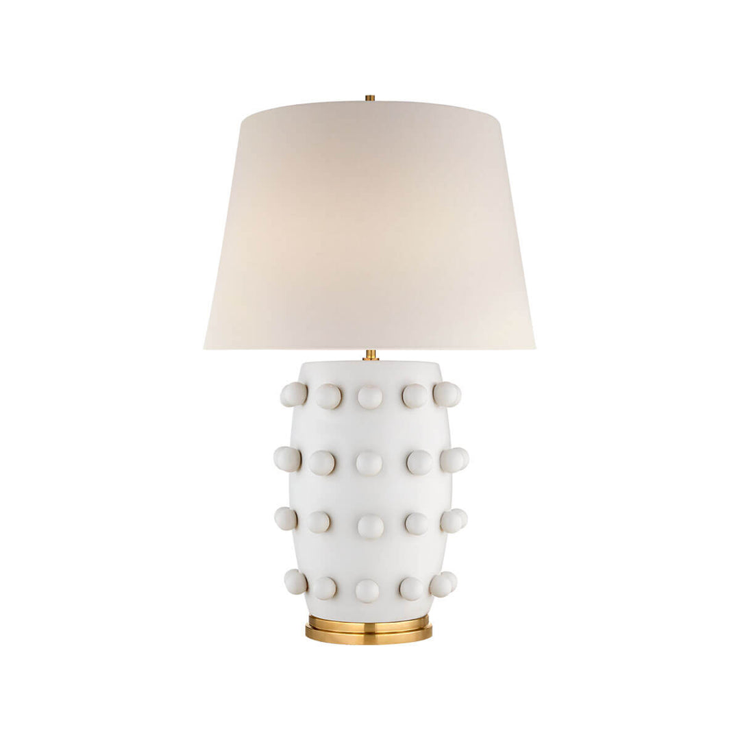 The Linden Table Lamp is a statement lamp with a plaster white base with ball details and an off white linen shade.