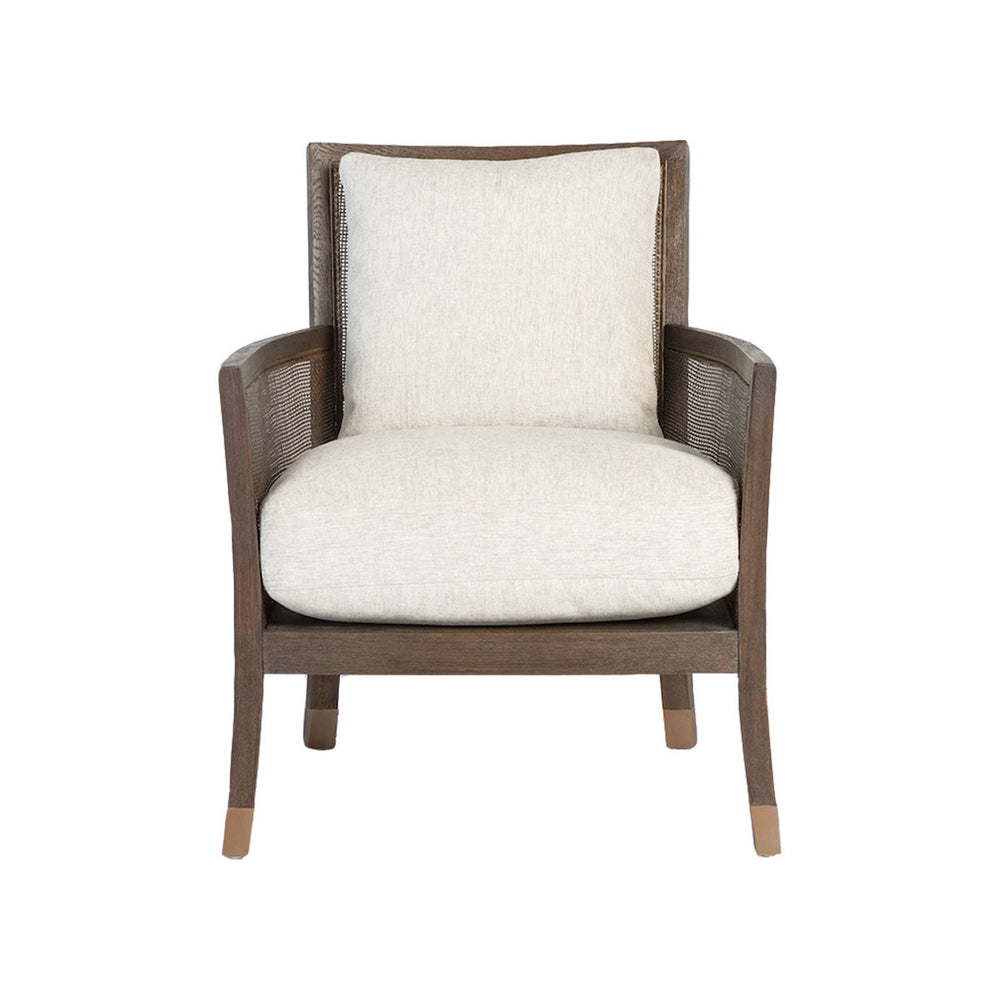 Front view of the Lockwood Occasional Chair. Featuring comfortable wheat coloured cushions and elegant soft brass details on the slim tapered legs.