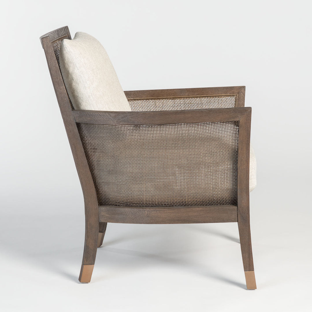 A side view of the Lockwood Occasional chair, showcasing the intricate espresso-stained birch wood mesh.