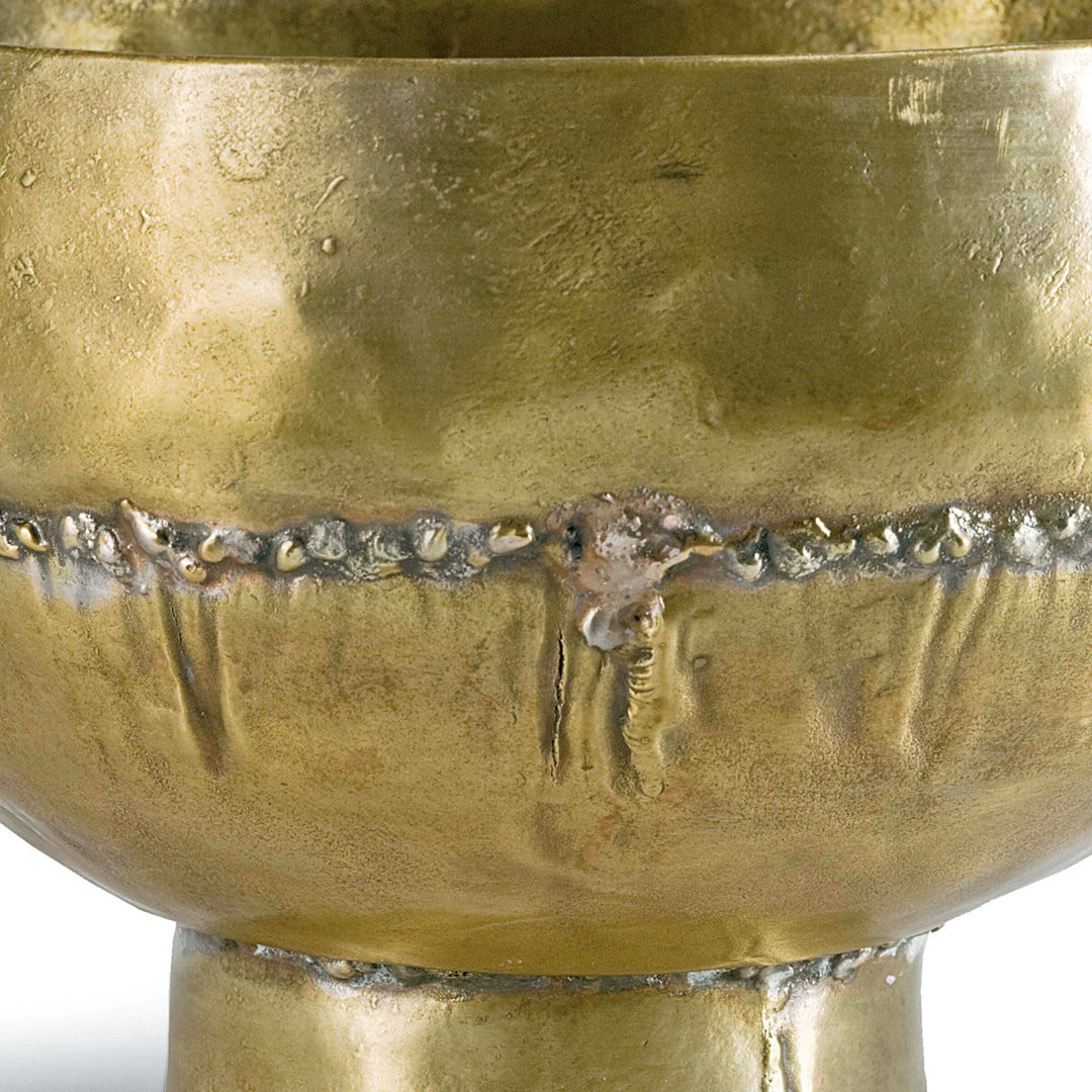 Soldered seam on decorative brass bowl.