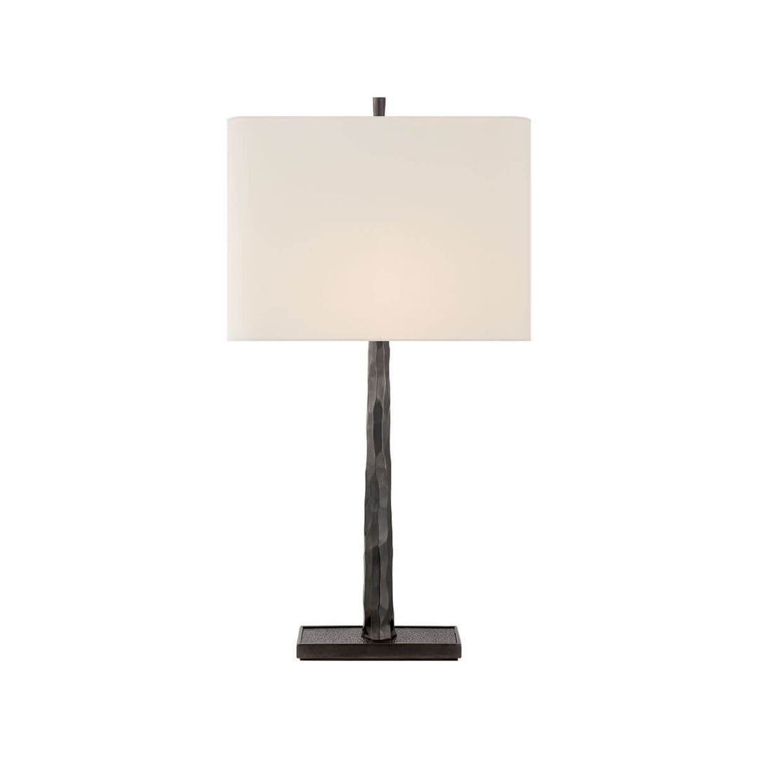 The Lyric Table Lamp has a wood-like, textured body in a bronze finish with a rectangular linen shade.