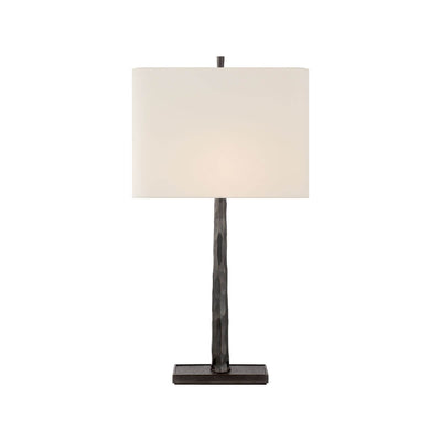 The Lyric Table Lamp has a wood-like, textured body in a bronze finish with a rectangular linen shade.