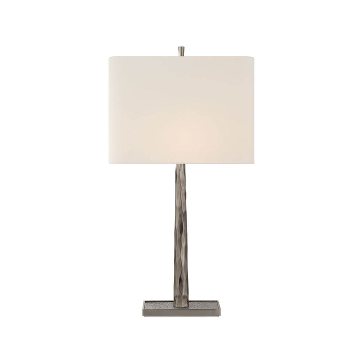 The Lyric Table Lamp has a wood-like, textured body in a pewter finish with a rectangular linen shade.
