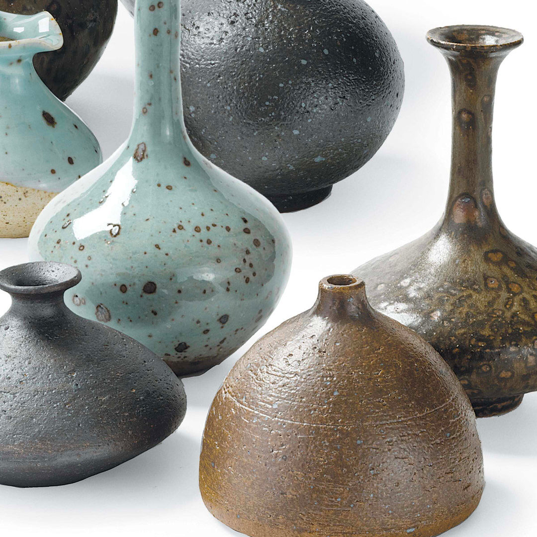 Different shaped vases in blue and brown.